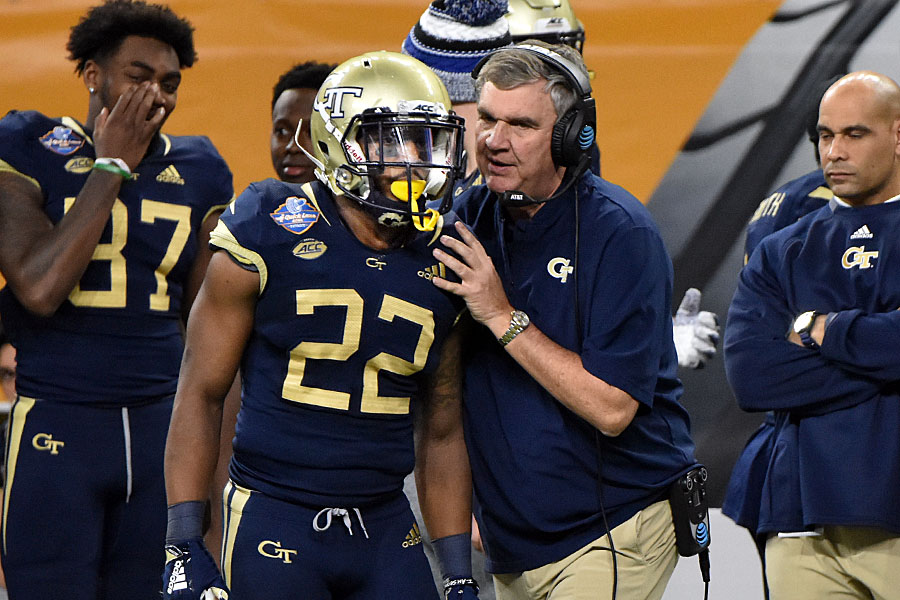Georgia Tech head coach Paul Johnson sends a play onto the field with Clinton Lynch (22), during the 2018 Quick Lane Bowl at Ford Field in Detroit. In Johnson's final game before retirement, the Yellow Jackets fell to the Minnesota Golden Gophers 34-10.Photo by Ian Shalapata.