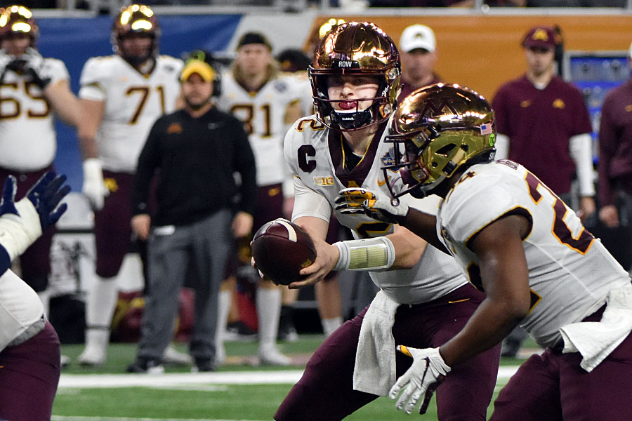 The Minnesota tandem of QB Taner Morgan (2) and TB Mohamed Ibrahim teamed up to defeat the Georgia Tech Yellow Jackets at the 2018 Quick Lane Bowl at Ford Field on 26 December. The Golden Gophers ran to a 34-10 win for their second victory at the annual bowl game in Detroit.Photo by Ian Shalapata.