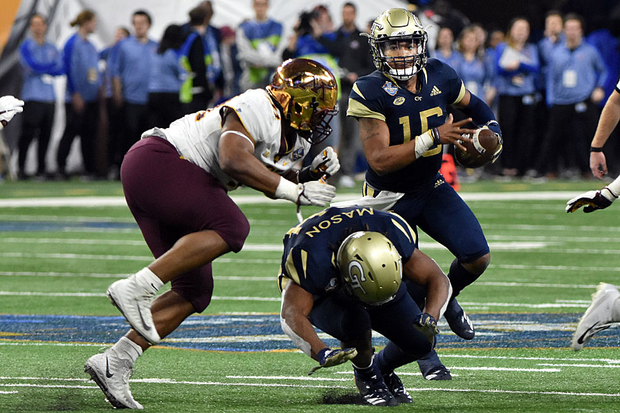 Jordan Mason attempts to block a Minnesota defender from getting to Georgia Tech QB TaQuon Marshall (16), during the 2018 Quick Lane Bowl in Detroit.Photo by Ian Shalapata.