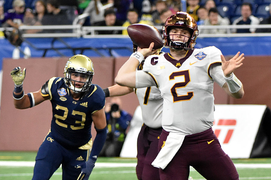 Minnesota's QB Tanner Morgan sets up to pass down field late in the 2018 Quick Lane Bowl. Morgan was 7-of-13 for 132 yards and 2 TDs as well as running for 3 yards on 3 carries.Photo by Ian Shalapata.